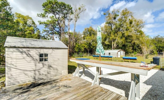 1922 Locust Ave, Palatka, FL 32177 - deck with a storage shed and view of wooded area
