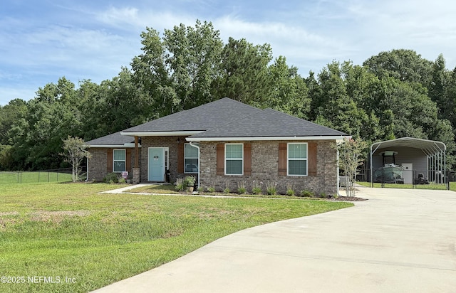 51321 Bloomington Way, Callahan, FL 32011 - view of front of property with a detached carport, driveway, roof with shingles, and brick siding