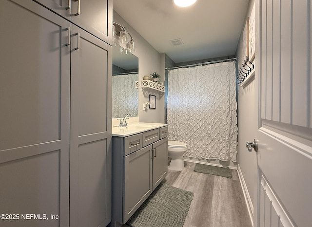 51321 Bloomington Way, Callahan, FL 32011 - full bath featuring vanity, wood finished floors, and curtained shower