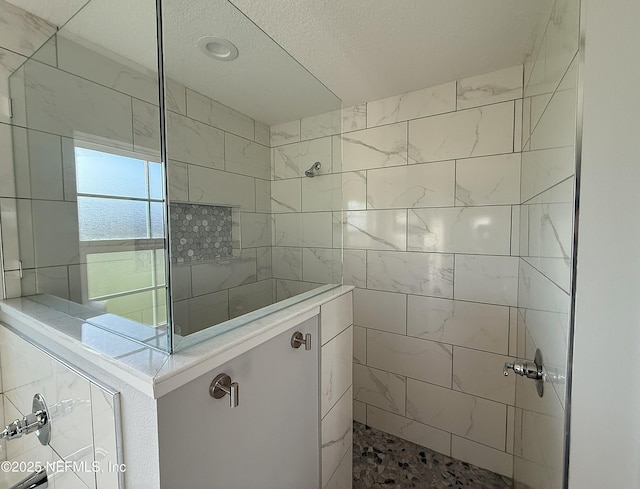 51321 Bloomington Way, Callahan, FL 32011 - bathroom featuring walk in shower and a textured ceiling