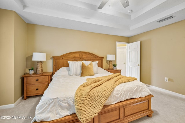 1020 Candlebark Dr, Jacksonville, FL 32225 - bedroom with a tray ceiling, light colored carpet, and ceiling fan