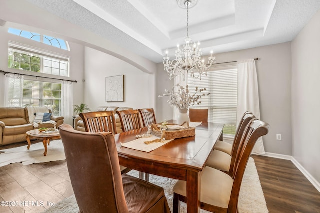 1020 Candlebark Dr, Jacksonville, FL 32225 - dining room with a chandelier and a raised ceiling