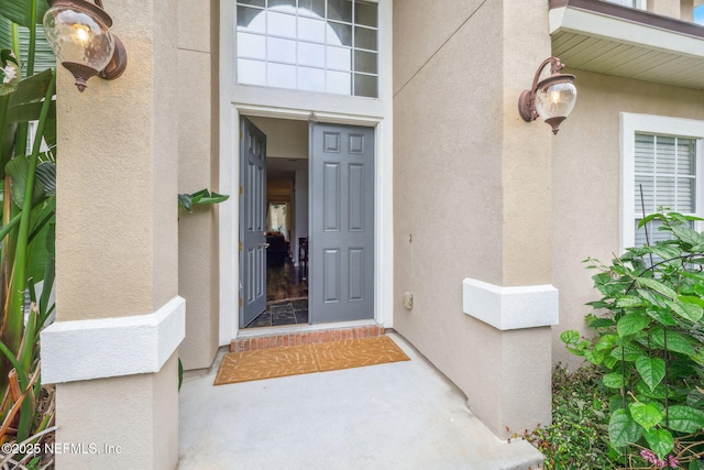 1020 Candlebark Dr, Jacksonville, FL 32225 - view of exterior entry with stucco siding