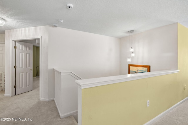 1020 Candlebark Dr, Jacksonville, FL 32225 - corridor featuring carpet flooring, a textured ceiling, and an upstairs landing