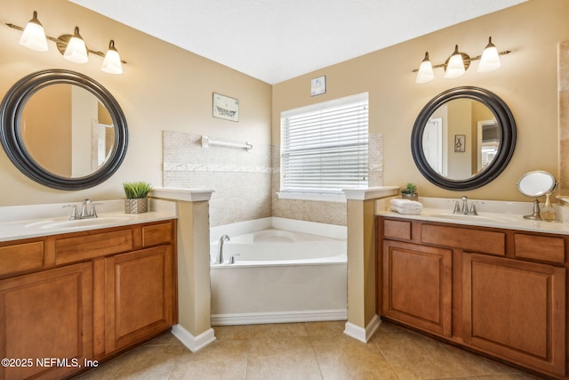 1020 Candlebark Dr, Jacksonville, FL 32225 - full bath featuring a garden tub, two vanities, and tile patterned flooring
