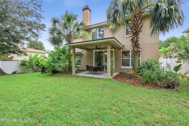 1020 Candlebark Dr, Jacksonville, FL 32225 - back of property with stucco siding, a ceiling fan, a fenced backyard, and a patio area