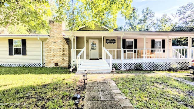 3822 County Road 220, Middleburg, FL 32068 - ranch-style home featuring a chimney and a porch