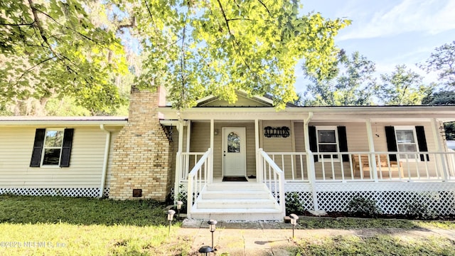 3822 County Road 220, Middleburg, FL 32068 - ranch-style home featuring a chimney and covered porch