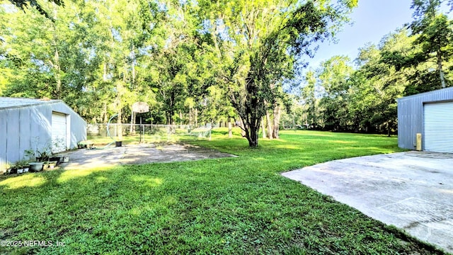 3822 County Road 220, Middleburg, FL 32068 - view of green lawn featuring an outbuilding and view of scattered trees