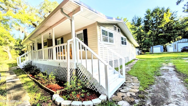 3822 County Road 220, Middleburg, FL 32068 - view of home's exterior featuring a porch, a lawn, and stairway