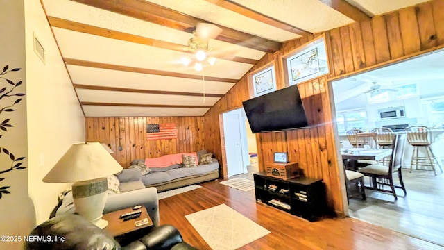 3822 County Road 220, Middleburg, FL 32068 - living area featuring ceiling fan, wood walls, and wood finished floors