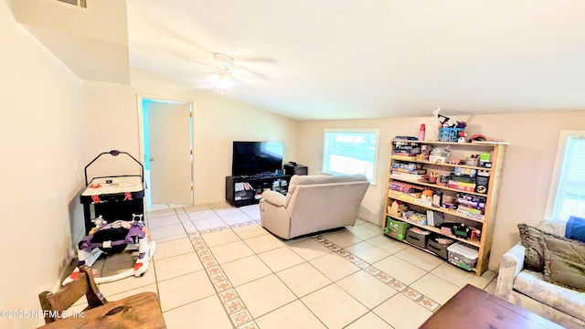 3822 County Road 220, Middleburg, FL 32068 - living area featuring light tile patterned floors, vaulted ceiling, and ceiling fan