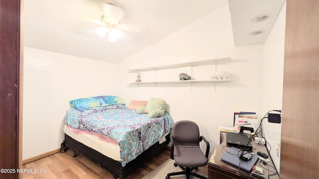 3822 County Road 220, Middleburg, FL 32068 - bedroom featuring wood finished floors, vaulted ceiling, a desk, and ceiling fan