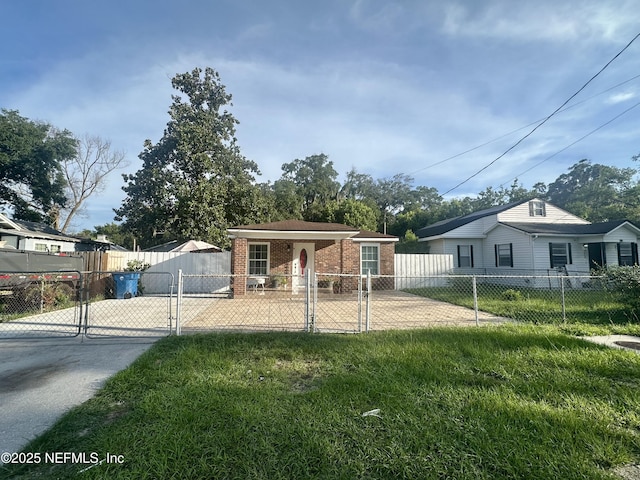 8300 Berry, Jacksonville, FL 32211 - view of front of property with a gate, brick siding, a fenced front yard, and driveway