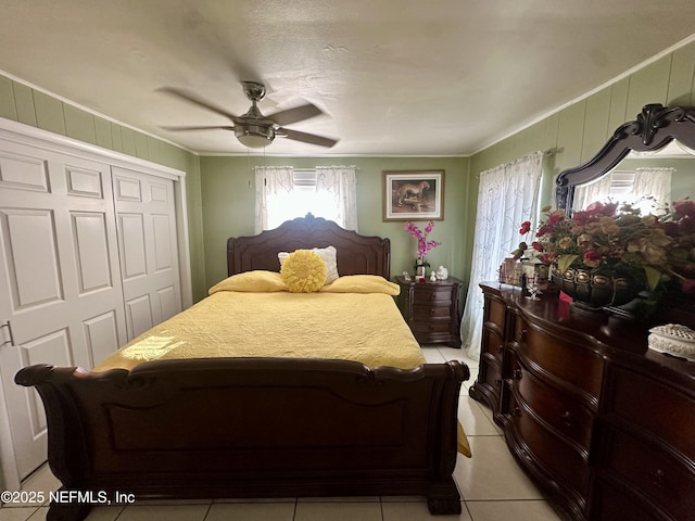 8300 Berry, Jacksonville, FL 32211 - bedroom featuring crown molding, a closet, light tile patterned flooring, and ceiling fan