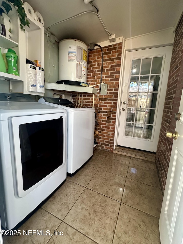 8300 Berry, Jacksonville, FL 32211 - washroom featuring independent washer and dryer, brick wall, electric water heater, and tile patterned floors