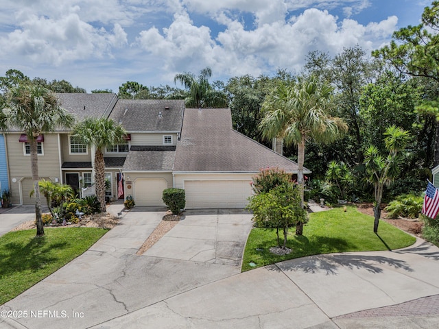 335 Sunrise Cir, Neptune Beach, FL 32266 - traditional-style house with driveway, a front yard, a shingled roof, and an attached garage