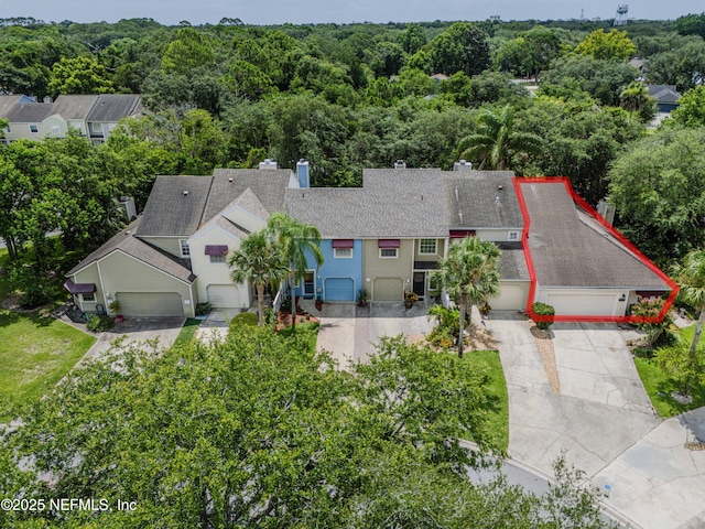 335 Sunrise Cir, Neptune Beach, FL 32266 - aerial view of property and surrounding area with a forest
