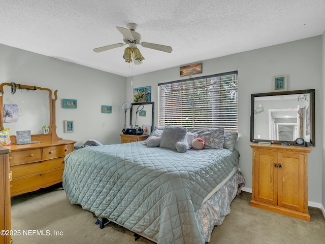 335 Sunrise Cir, Neptune Beach, FL 32266 - bedroom featuring light colored carpet, a ceiling fan, and a textured ceiling