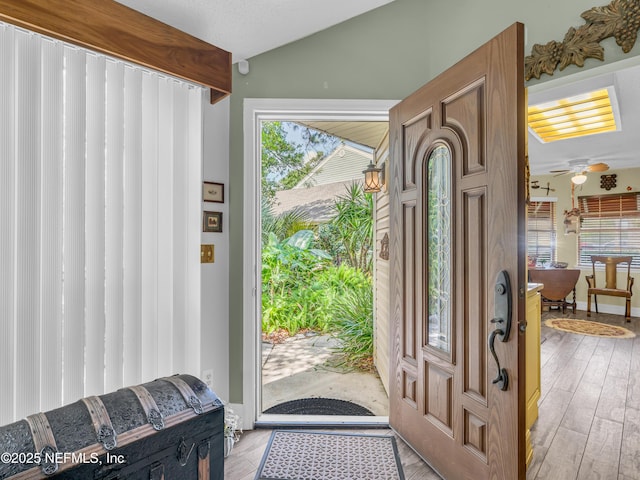 335 Sunrise Cir, Neptune Beach, FL 32266 - foyer featuring vaulted ceiling, a ceiling fan, and light wood-type flooring