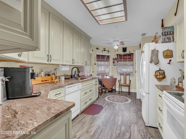 335 Sunrise Cir, Neptune Beach, FL 32266 - kitchen featuring white appliances, ceiling fan, light wood-style flooring, and cream cabinetry