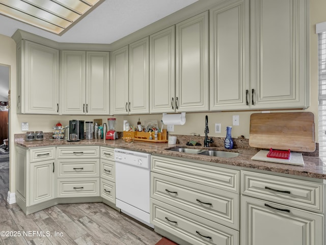 335 Sunrise Cir, Neptune Beach, FL 32266 - kitchen with dishwasher, stone countertops, and light wood-type flooring