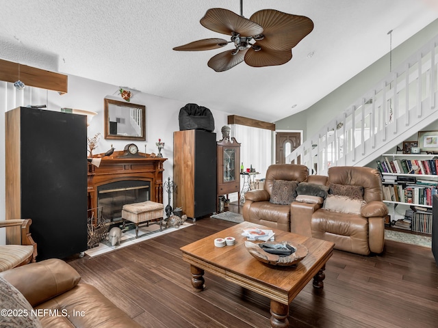 335 Sunrise Cir, Neptune Beach, FL 32266 - living room featuring ceiling fan, wood finished floors, a glass covered fireplace, stairs, and lofted ceiling