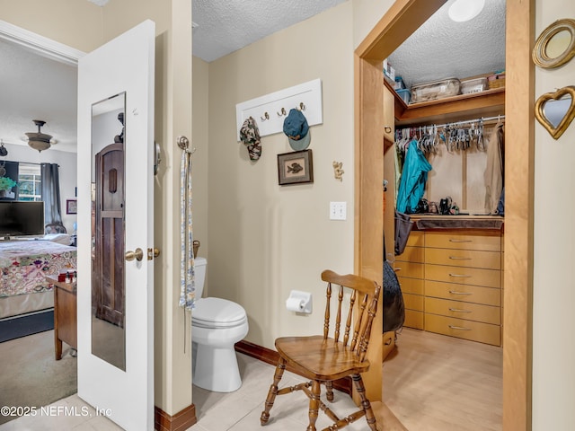 335 Sunrise Cir, Neptune Beach, FL 32266 - bathroom with a textured ceiling and ensuite bathroom
