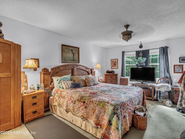 335 Sunrise Cir, Neptune Beach, FL 32266 - bedroom featuring light colored carpet, a textured ceiling, and a ceiling fan