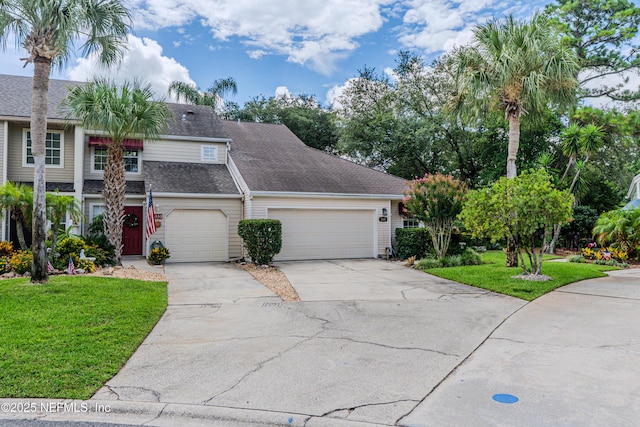 335 Sunrise Cir, Neptune Beach, FL 32266 - traditional-style house featuring concrete driveway, a front yard, an attached garage, and a shingled roof