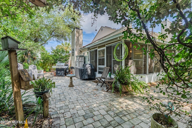 335 Sunrise Cir, Neptune Beach, FL 32266 - view of patio / terrace with a sunroom