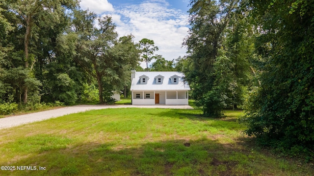 343 Tinsley Rd, Florahome, FL 32140 - view of front of house featuring driveway, a front yard, and a porch