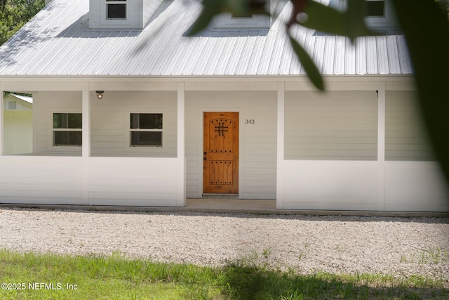 343 Tinsley Rd, Florahome, FL 32140 - doorway to property with a metal roof and covered porch