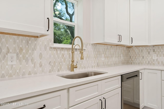 343 Tinsley Rd, Florahome, FL 32140 - kitchen with dishwasher, light countertops, white cabinetry, and tasteful backsplash