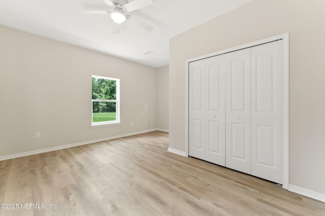 343 Tinsley Rd, Florahome, FL 32140 - unfurnished bedroom featuring light wood-style floors, a closet, and ceiling fan