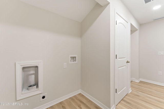 343 Tinsley Rd, Florahome, FL 32140 - washroom with hookup for a washing machine, light wood-type flooring, and electric dryer hookup