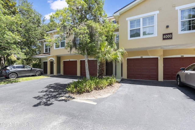 4000 Grande Vista Blvd Unit 15-106, Saint Augustine, FL 32084 - mediterranean / spanish-style house featuring stucco siding, a garage, and driveway