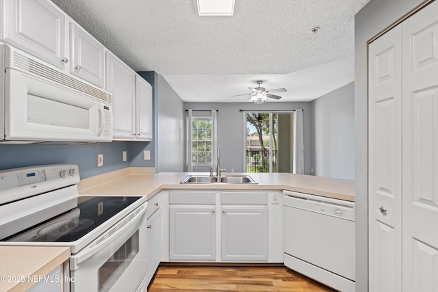 4000 Grande Vista Blvd Unit 15-106, Saint Augustine, FL 32084 - kitchen with white appliances, a textured ceiling, light countertops, white cabinetry, and ceiling fan