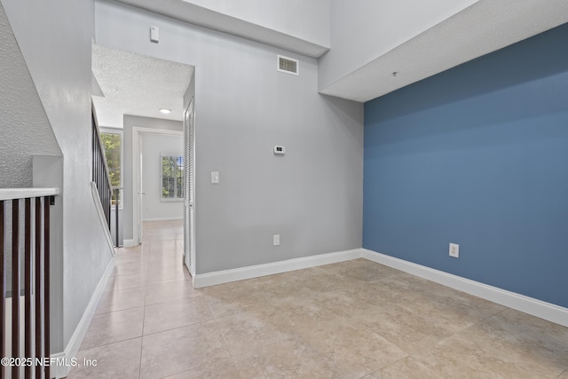 4000 Grande Vista Blvd Unit 15-106, Saint Augustine, FL 32084 - spare room featuring light tile patterned floors and a textured ceiling