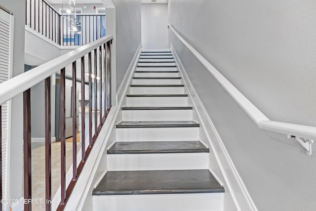 4000 Grande Vista Blvd Unit 15-106, Saint Augustine, FL 32084 - staircase with a chandelier
