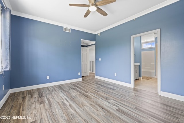 4000 Grande Vista Blvd Unit 15-106, Saint Augustine, FL 32084 - unfurnished bedroom featuring wood finished floors, ensuite bath, crown molding, and ceiling fan