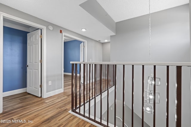 4000 Grande Vista Blvd Unit 15-106, Saint Augustine, FL 32084 - corridor with an upstairs landing, wood finished floors, and recessed lighting