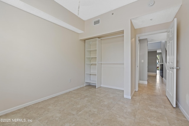 4000 Grande Vista Blvd Unit 15-106, Saint Augustine, FL 32084 - unfurnished bedroom with a closet and light tile patterned flooring