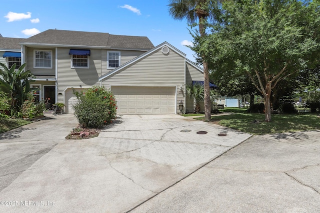 1430 Spindrift Cir E, Neptune Beach, FL 32266 - traditional home with driveway, a garage, a front lawn, and a shingled roof
