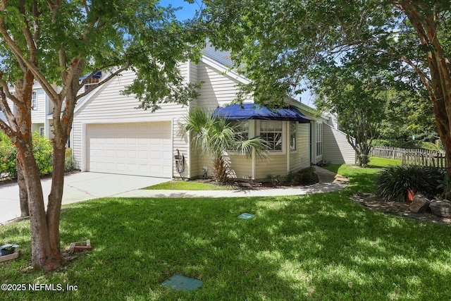 1430 Spindrift Cir E, Neptune Beach, FL 32266 - view of front of house with concrete driveway and a garage