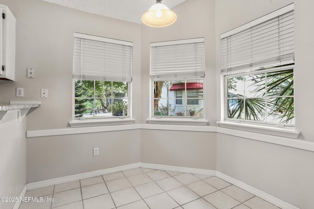 1430 Spindrift Cir E, Neptune Beach, FL 32266 - unfurnished dining area featuring baseboards