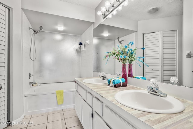 1430 Spindrift Cir E, Neptune Beach, FL 32266 - bathroom featuring a closet, bathing tub / shower combination, double vanity, tile patterned floors, and a textured ceiling
