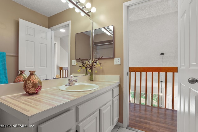 1430 Spindrift Cir E, Neptune Beach, FL 32266 - bathroom featuring vanity, a textured ceiling, and tile patterned flooring