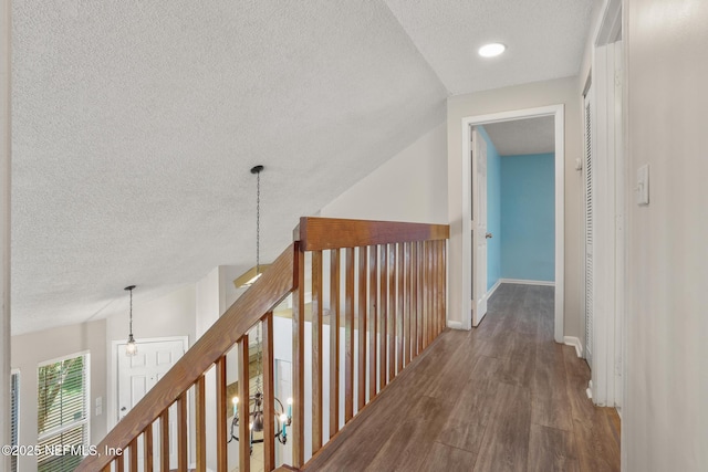 1430 Spindrift Cir E, Neptune Beach, FL 32266 - hallway with a textured ceiling and wood finished floors
