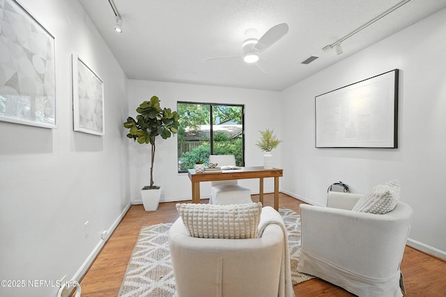 1918 Oak Cir, Atlantic Beach, FL 32233 - office with rail lighting, ceiling fan, and light wood-style flooring